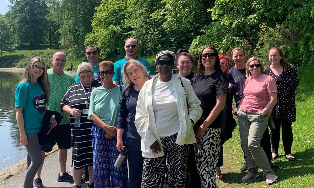 Members of the fostering community stood together at the park